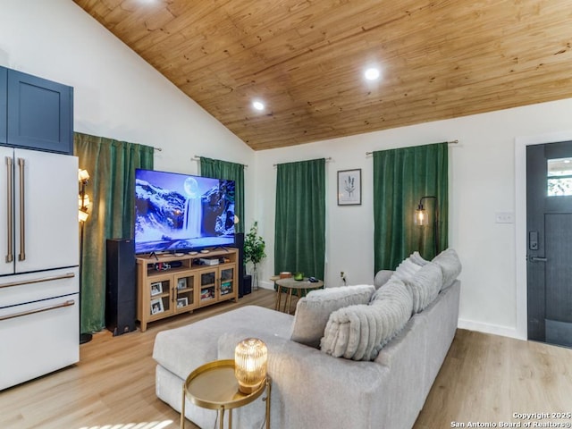 cinema room with vaulted ceiling, wooden ceiling, and light wood-type flooring