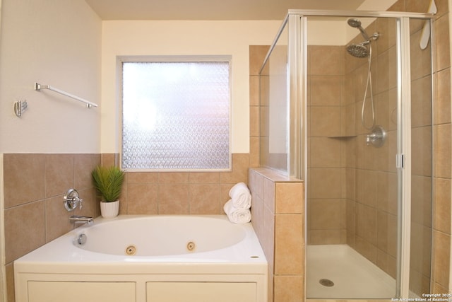 bathroom with shower with separate bathtub