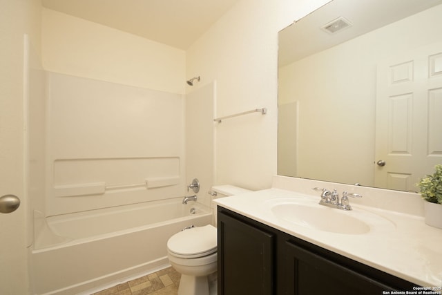 full bathroom featuring vanity, bathing tub / shower combination, and toilet