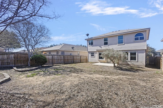 back of house with a patio