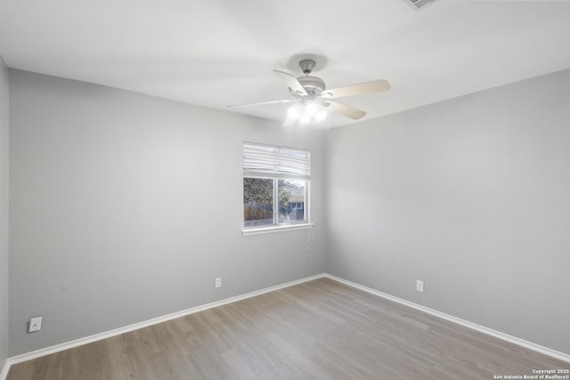 unfurnished room featuring hardwood / wood-style flooring and ceiling fan