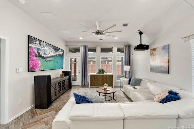 living room featuring ceiling fan and light parquet flooring