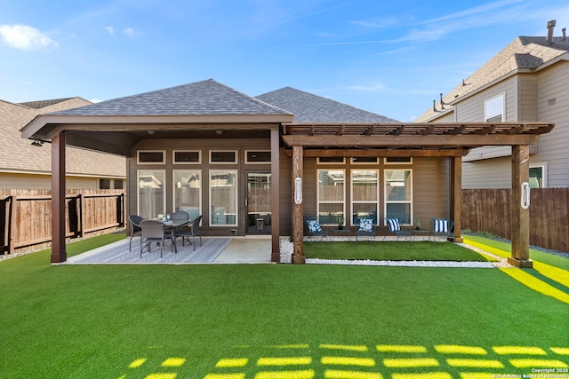 back of house featuring a pergola, a yard, and a patio area