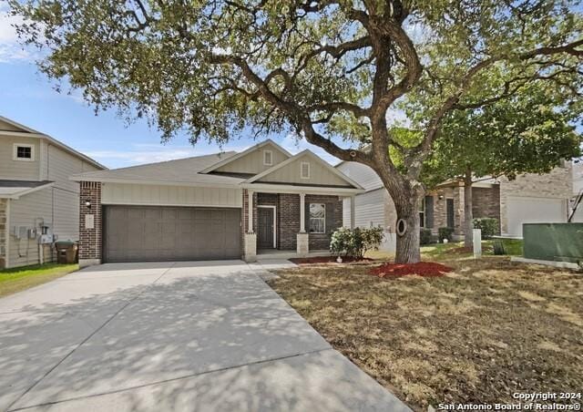 view of front of property with a garage and a front yard