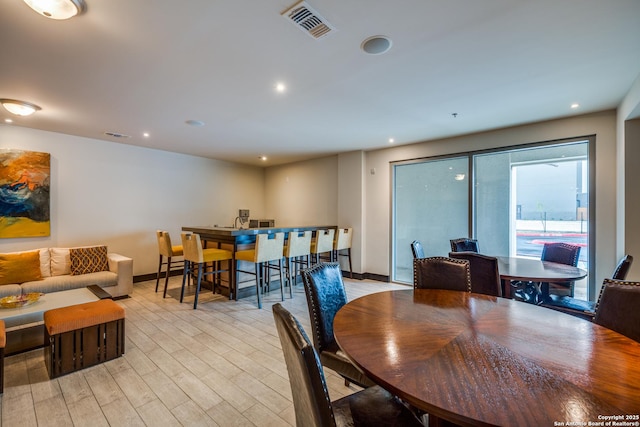 dining space featuring light hardwood / wood-style floors