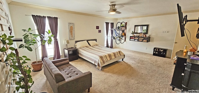 carpeted bedroom with crown molding and ceiling fan