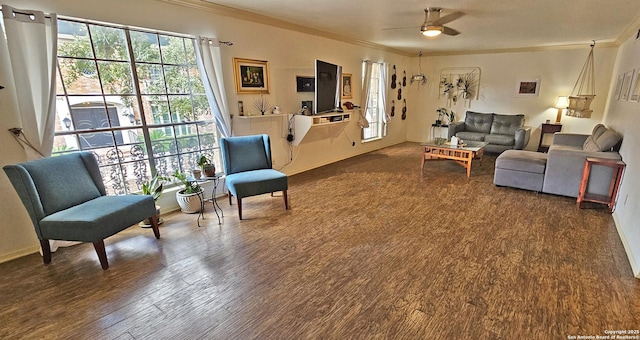 living room featuring crown molding, hardwood / wood-style flooring, and ceiling fan