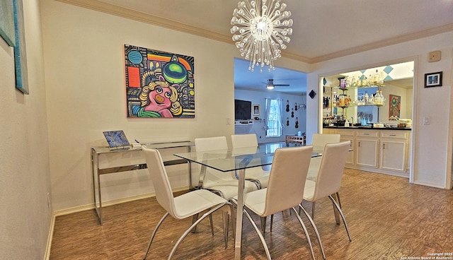 dining space featuring a notable chandelier, crown molding, and light hardwood / wood-style floors