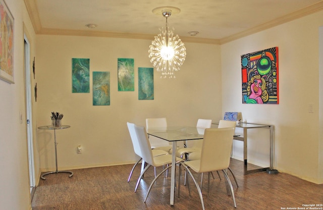 dining space with crown molding, a chandelier, and hardwood / wood-style floors