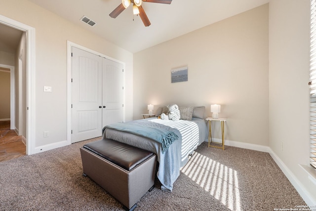 bedroom featuring a closet, ceiling fan, and carpet flooring