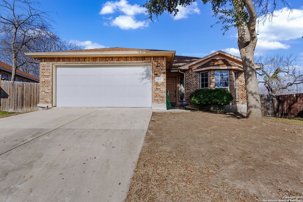 single story home featuring a garage