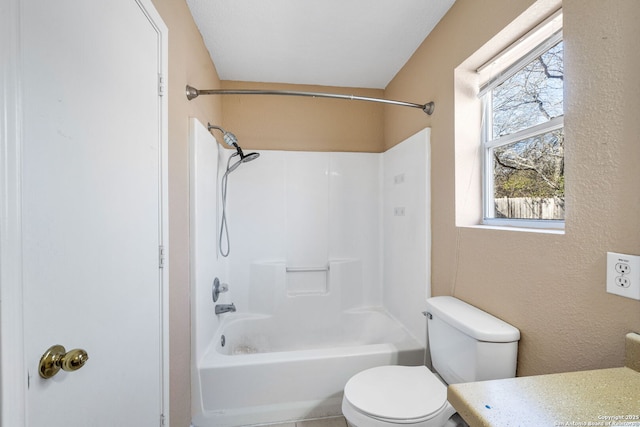 full bathroom with vanity, washtub / shower combination, and toilet