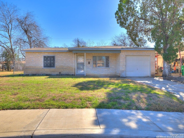 ranch-style home with a garage and a front lawn