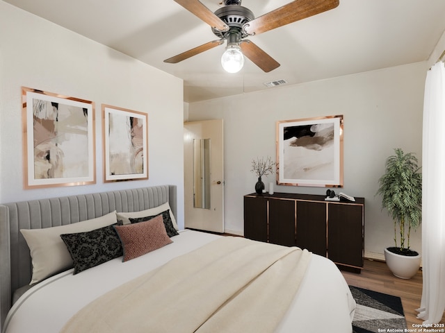 bedroom featuring wood-type flooring and ceiling fan