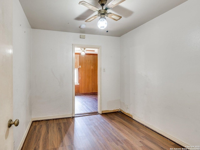 unfurnished room with hardwood / wood-style flooring and ceiling fan