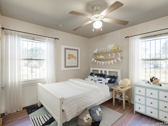 bedroom featuring hardwood / wood-style flooring and ceiling fan