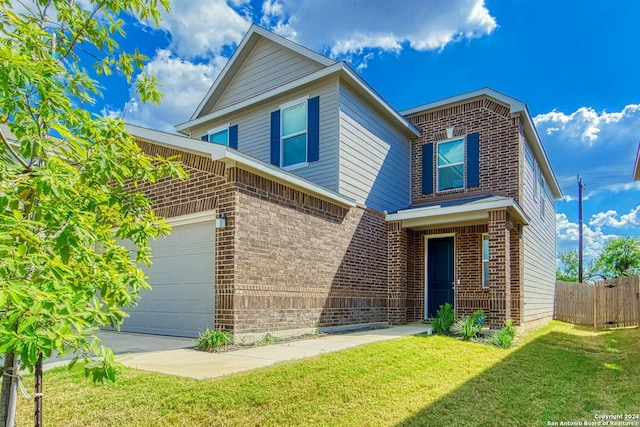 view of front property with a garage and a front yard