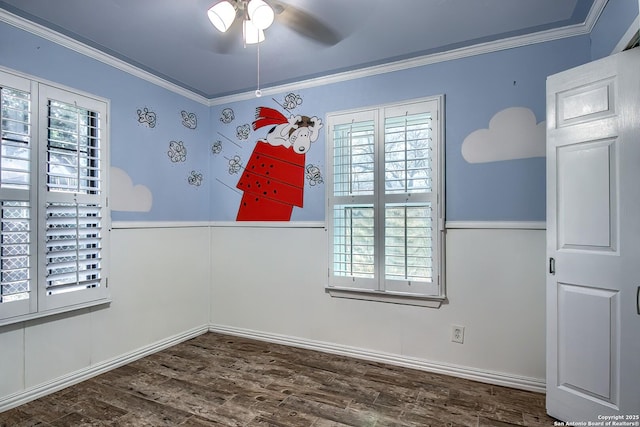 unfurnished room featuring hardwood / wood-style flooring, ceiling fan, and ornamental molding