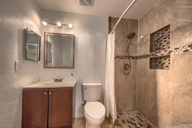 bathroom featuring vanity, a shower with curtain, and toilet