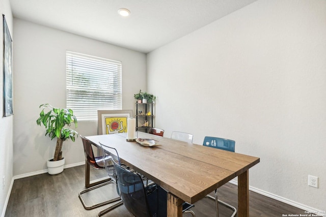 dining room with dark wood-type flooring