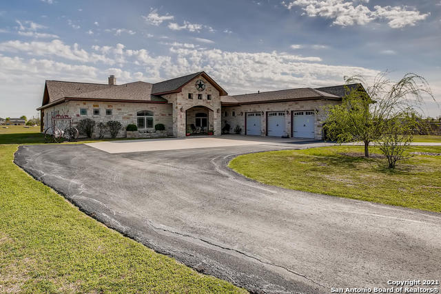 view of front of home with a garage and a front yard