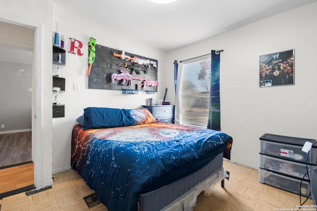 bedroom featuring parquet floors