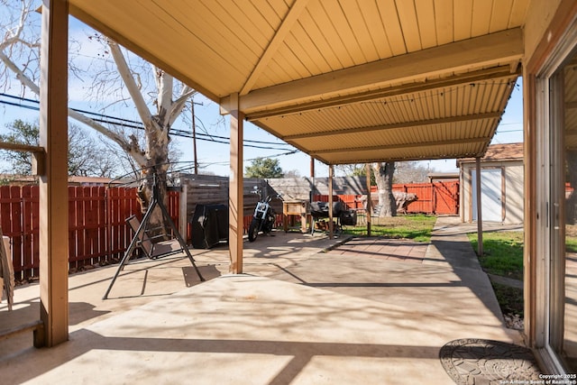 view of patio featuring a shed