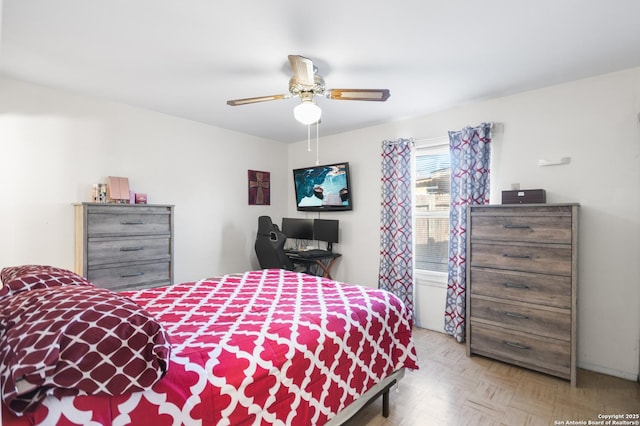 bedroom featuring light parquet floors and ceiling fan