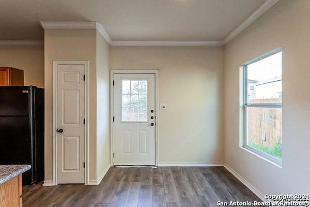 interior space with ornamental molding and dark hardwood / wood-style floors