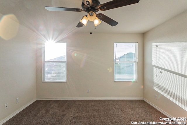 empty room featuring dark carpet