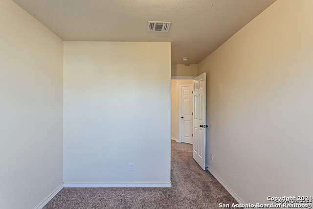 empty room featuring carpet flooring