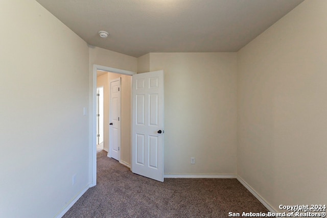 empty room with carpet flooring