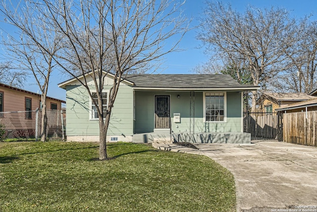 bungalow-style house with a front lawn