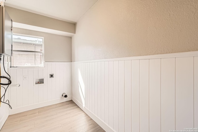 laundry room featuring washer hookup, hookup for an electric dryer, and light wood-type flooring