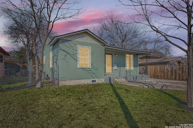 view of front of home with a yard