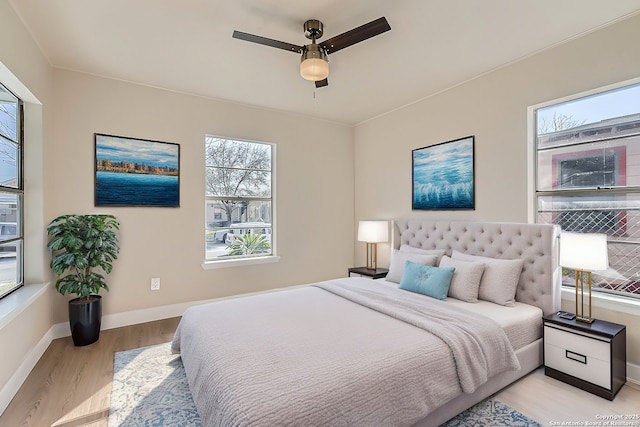 bedroom featuring ceiling fan and light wood-type flooring