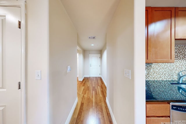 corridor featuring light hardwood / wood-style flooring