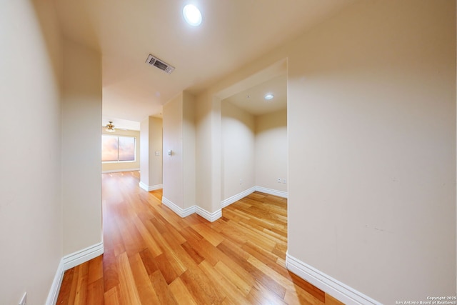 hall with hardwood / wood-style flooring