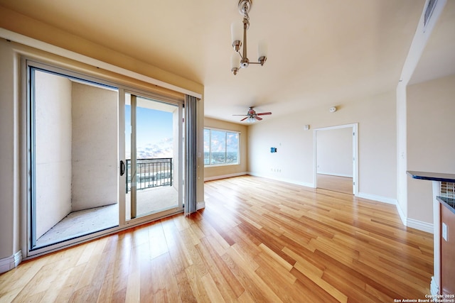 unfurnished living room with ceiling fan and light hardwood / wood-style flooring