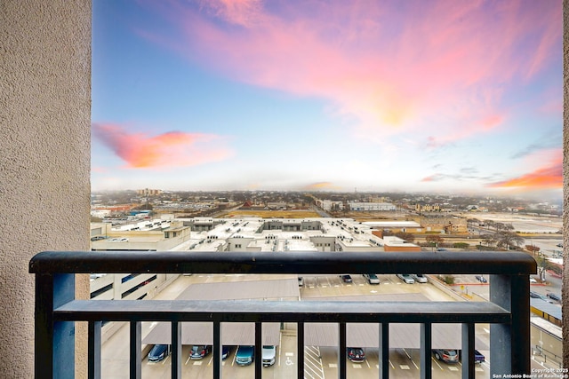 view of balcony at dusk