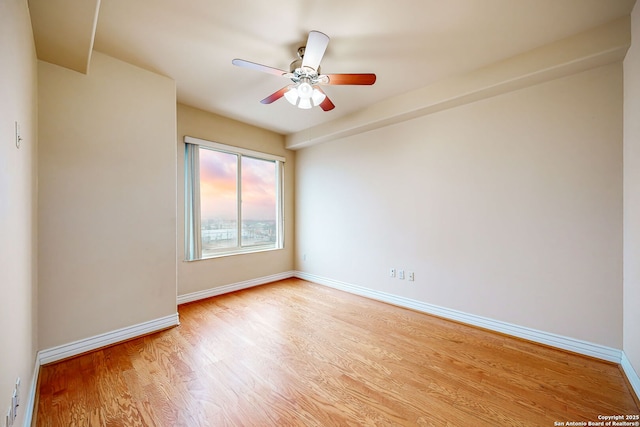 unfurnished room with ceiling fan and light hardwood / wood-style floors