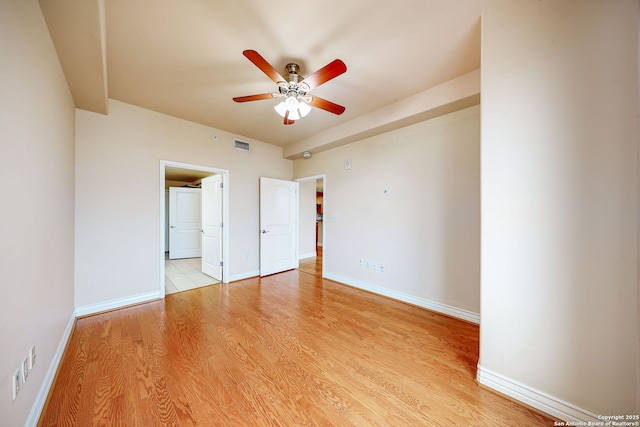 unfurnished bedroom featuring connected bathroom and light wood-type flooring