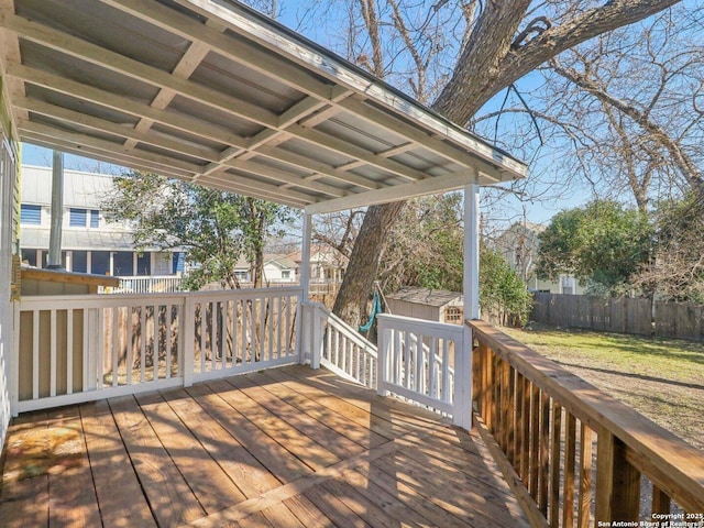 deck featuring a shed