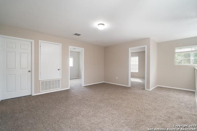 spare room featuring carpet floors