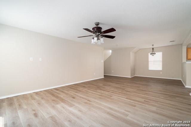 spare room with ceiling fan and light hardwood / wood-style flooring