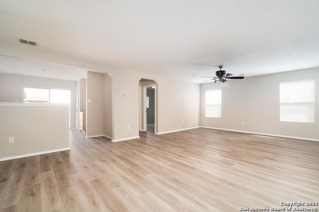 empty room featuring ceiling fan and light hardwood / wood-style floors