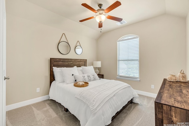 carpeted bedroom featuring vaulted ceiling and ceiling fan