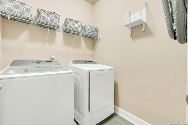 laundry room with washing machine and dryer