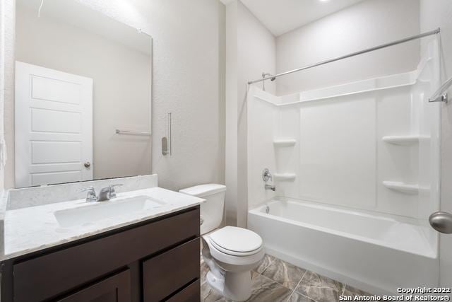 full bathroom with vanity, toilet, and washtub / shower combination