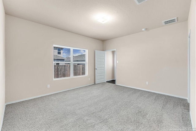 unfurnished room with light colored carpet